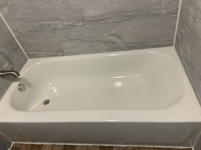 full bath featuring a bathtub