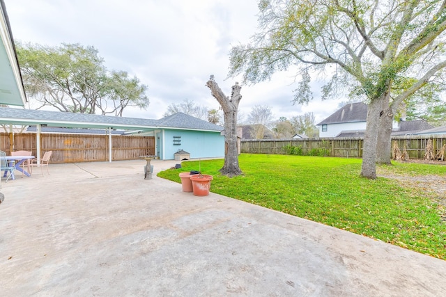 view of yard with a patio area and a fenced backyard