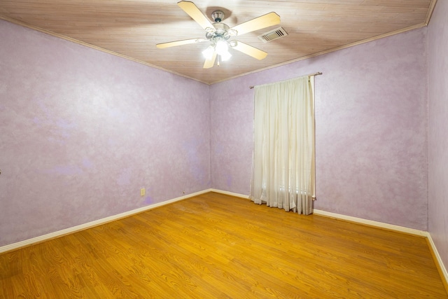 unfurnished room with light wood-style floors, visible vents, ceiling fan, and baseboards