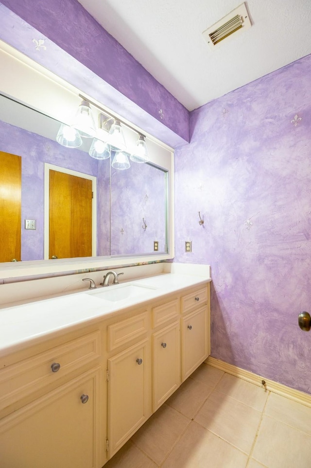 bathroom with vanity, tile patterned flooring, and visible vents