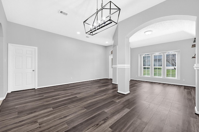 3520 White Oak Point Dr, Conroe, TX 77304 - interior space featuring arched walkways, visible vents, dark wood finished floors, and baseboards