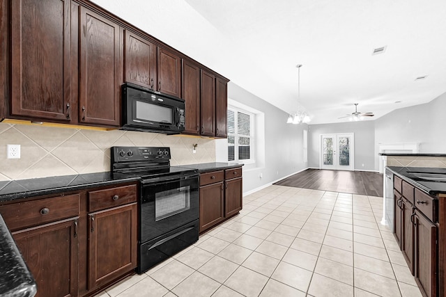 3520 White Oak Point Dr, Conroe, TX 77304 - kitchen with visible vents, backsplash, ceiling fan with notable chandelier, light tile patterned flooring, and black appliances