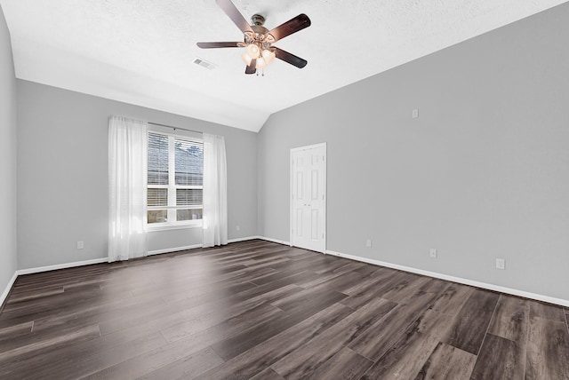3520 White Oak Point Dr, Conroe, TX 77304 - empty room featuring baseboards, visible vents, dark wood finished floors, lofted ceiling, and ceiling fan