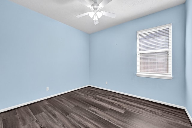 3520 White Oak Point Dr, Conroe, TX 77304 - spare room featuring ceiling fan, baseboards, and dark wood-style flooring