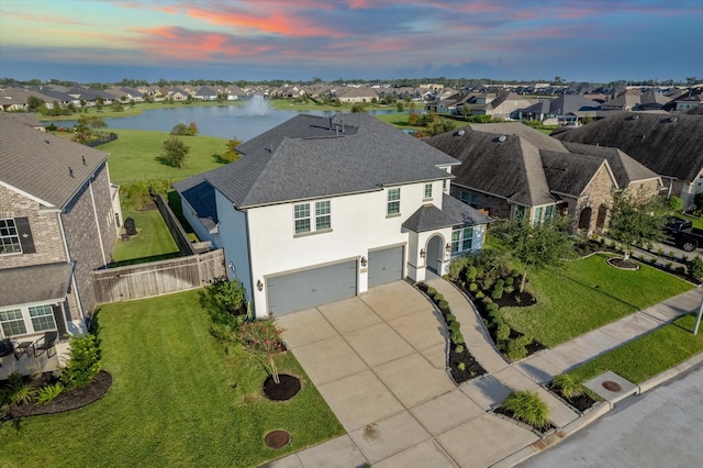 bird's eye view featuring a water view and a residential view