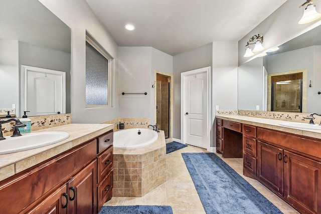 bathroom featuring a bath, a shower stall, a sink, and tile patterned floors