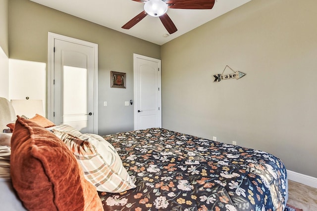 bedroom featuring ceiling fan and baseboards