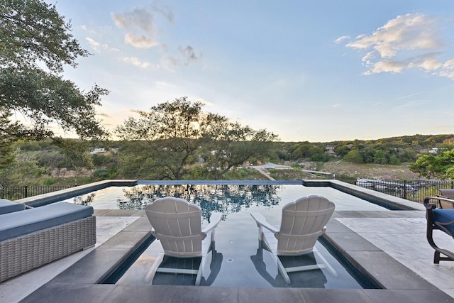 view of patio / terrace featuring fence