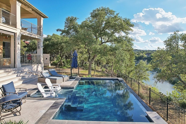 view of pool with a patio area, fence, and a fenced in pool