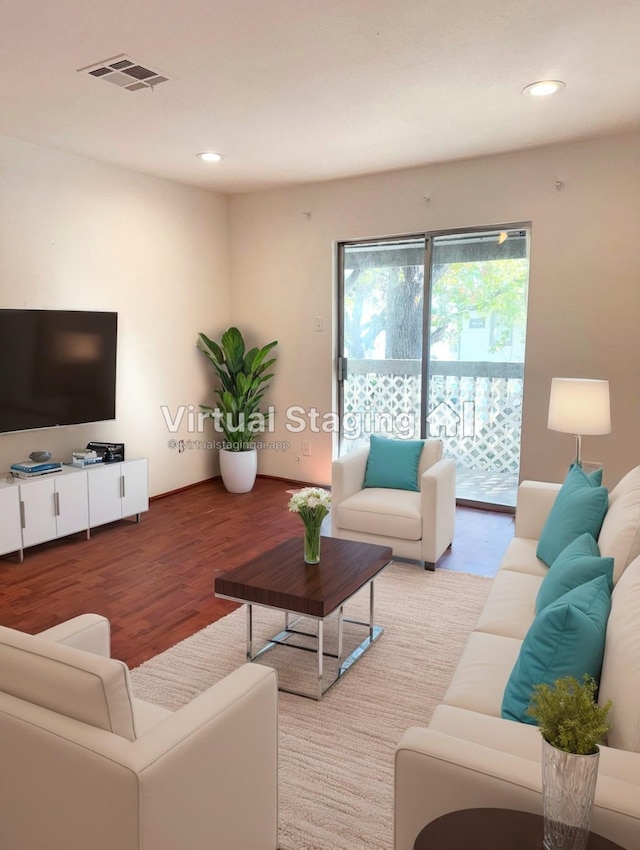 living room featuring recessed lighting, visible vents, and wood finished floors