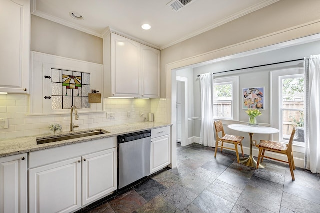 kitchen with visible vents, stone tile flooring, stainless steel dishwasher, white cabinetry, and a sink