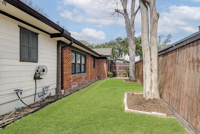 view of yard featuring a fenced backyard