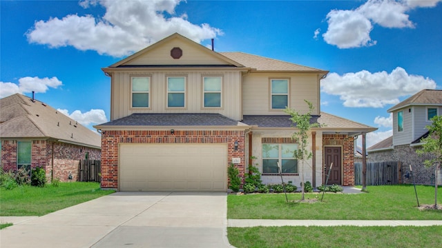 traditional home featuring driveway, an attached garage, fence, and a front yard