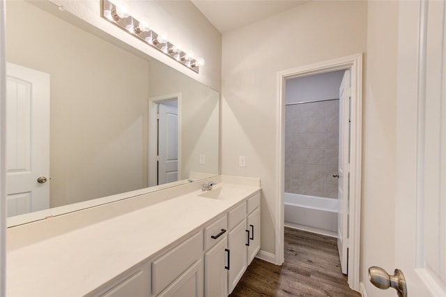 bathroom with wood finished floors and vanity