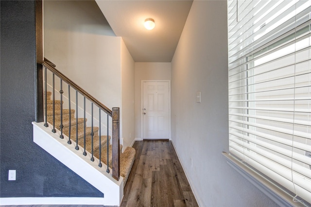 interior space featuring stairway, baseboards, and wood finished floors