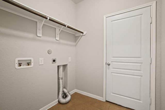 washroom featuring laundry area, washer hookup, baseboards, tile patterned floors, and electric dryer hookup