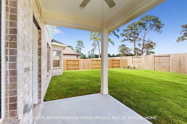 view of yard featuring a ceiling fan, a patio area, and a fenced backyard