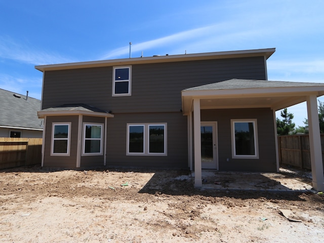 22427 Birchfield Grove Ln, New Caney, TX 77357 - rear view of house with a fenced backyard