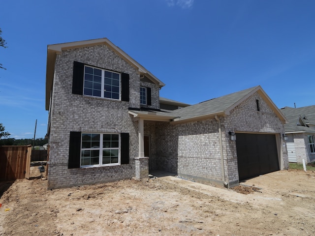 22427 Birchfield Grove Ln, New Caney, TX 77357 - view of front of house featuring a garage and brick siding
