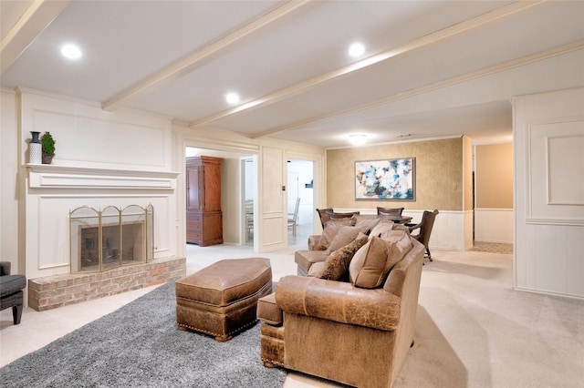 living room featuring light colored carpet, beamed ceiling, a fireplace, a decorative wall, and recessed lighting