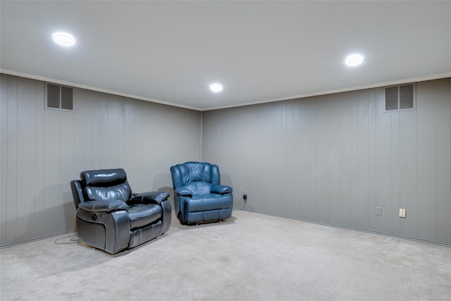 living area with carpet, visible vents, and recessed lighting