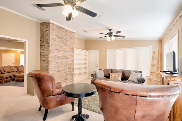 living area with carpet floors, ornamental molding, visible vents, and a ceiling fan