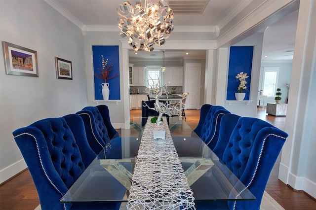 dining area featuring ornamental molding, wood finished floors, and a wealth of natural light