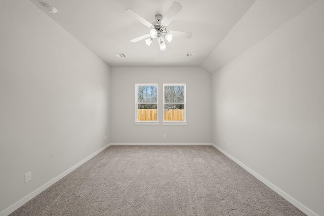 empty room with ceiling fan, carpet, visible vents, and baseboards