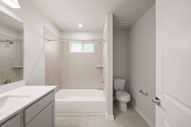 bathroom featuring visible vents, baseboards, toilet, tile patterned flooring, and vanity