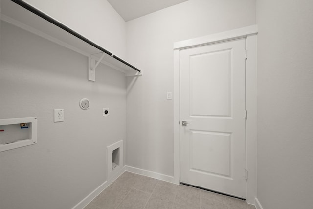 laundry area with hookup for a washing machine, hookup for an electric dryer, gas dryer hookup, laundry area, and baseboards