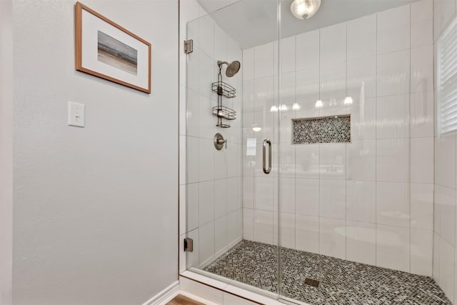 full bathroom featuring a shower stall