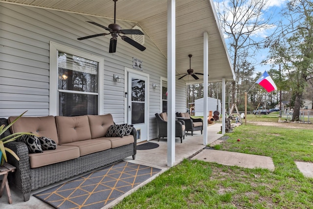 view of patio with outdoor lounge area and a ceiling fan