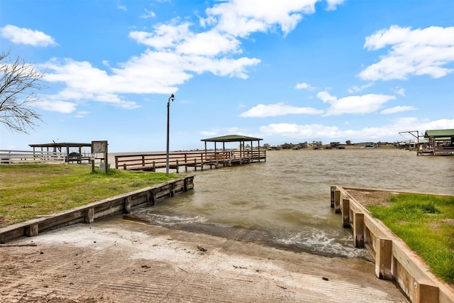 view of dock featuring a gazebo and a water view