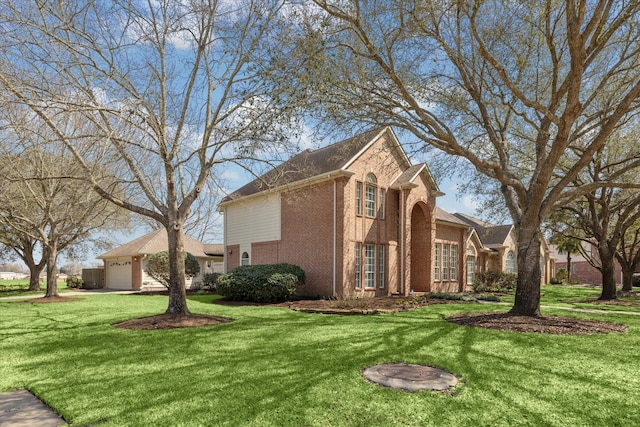 view of side of home with brick siding, a lawn, and an attached garage