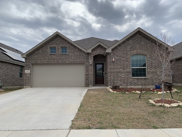 view of front facade featuring a garage, brick siding, concrete driveway, roof with shingles, and a front lawn