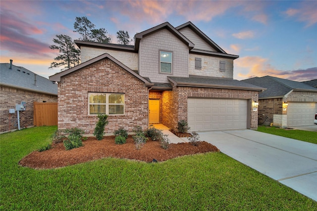 view of front of house featuring driveway, an attached garage, fence, a front lawn, and brick siding