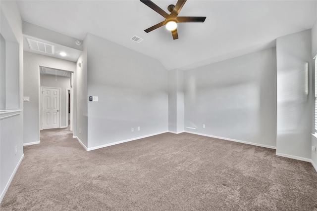 unfurnished room with attic access, visible vents, and carpet floors