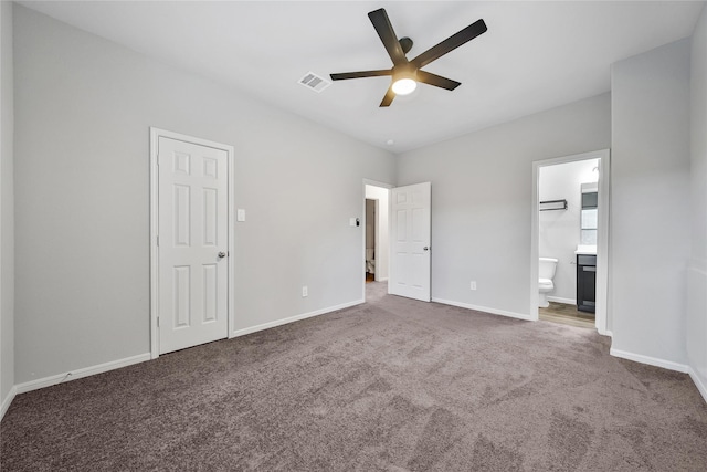 unfurnished bedroom with baseboards, visible vents, a ceiling fan, connected bathroom, and carpet floors