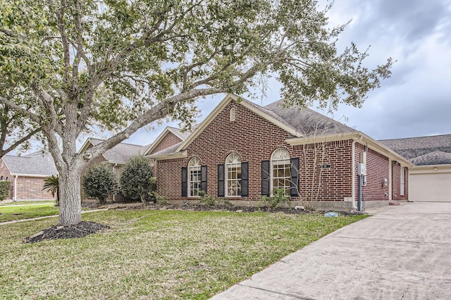 view of front of property featuring a garage, brick siding, a front lawn, and a shingled roof