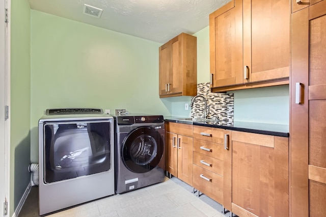 811 Piney Ridge Dr, Friendswood, TX 77546 - washroom with cabinet space and separate washer and dryer