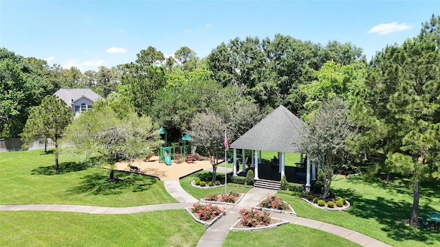811 Piney Ridge Dr, Friendswood, TX 77546 - view of property's community with a playground, a gazebo, and a lawn