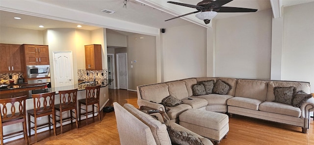 811 Piney Ridge Dr, Friendswood, TX 77546 - living room featuring a ceiling fan, light wood-style floors, and recessed lighting