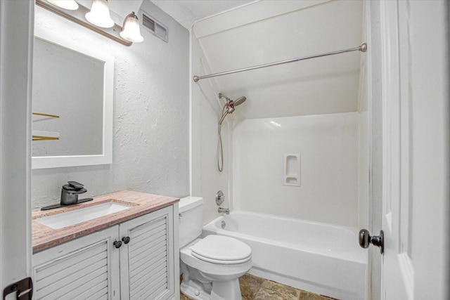 bathroom with visible vents, a textured wall, toilet, vanity, and shower / tub combination