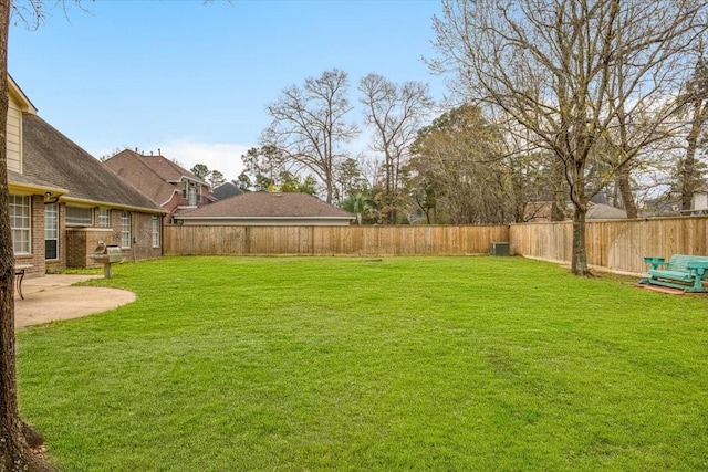 view of yard featuring a patio and a fenced backyard