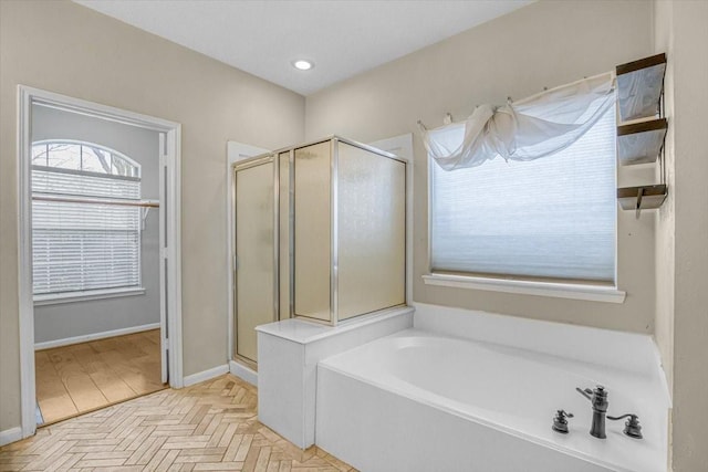 bathroom with a garden tub, a shower stall, baseboards, and recessed lighting