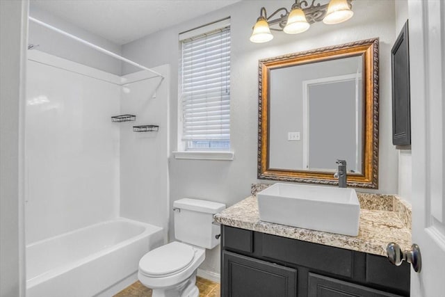 full bath with  shower combination, vanity, and toilet