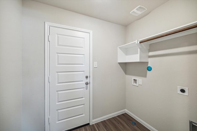 washroom featuring visible vents, dark wood-type flooring, baseboards, laundry area, and hookup for an electric dryer