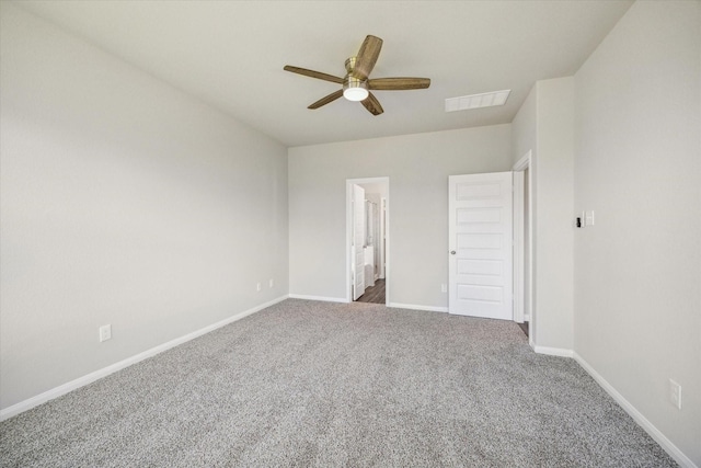 unfurnished bedroom with visible vents, connected bathroom, baseboards, carpet flooring, and a ceiling fan