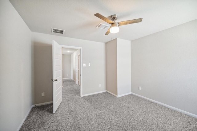 unfurnished bedroom featuring a ceiling fan, carpet flooring, baseboards, and visible vents