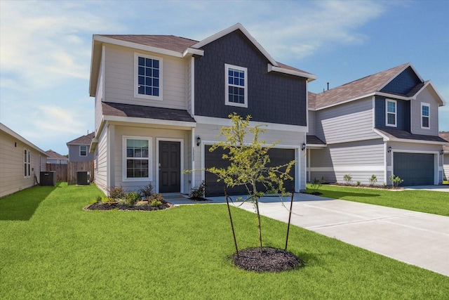 view of front of home with a front lawn, fence, concrete driveway, central AC unit, and an attached garage